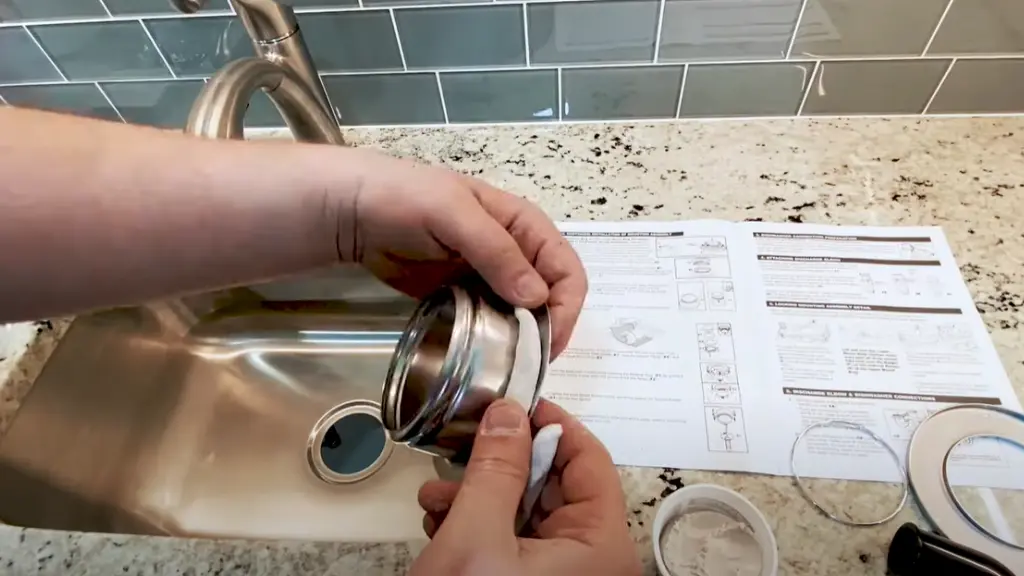 plumber putty rolling onto siink flange